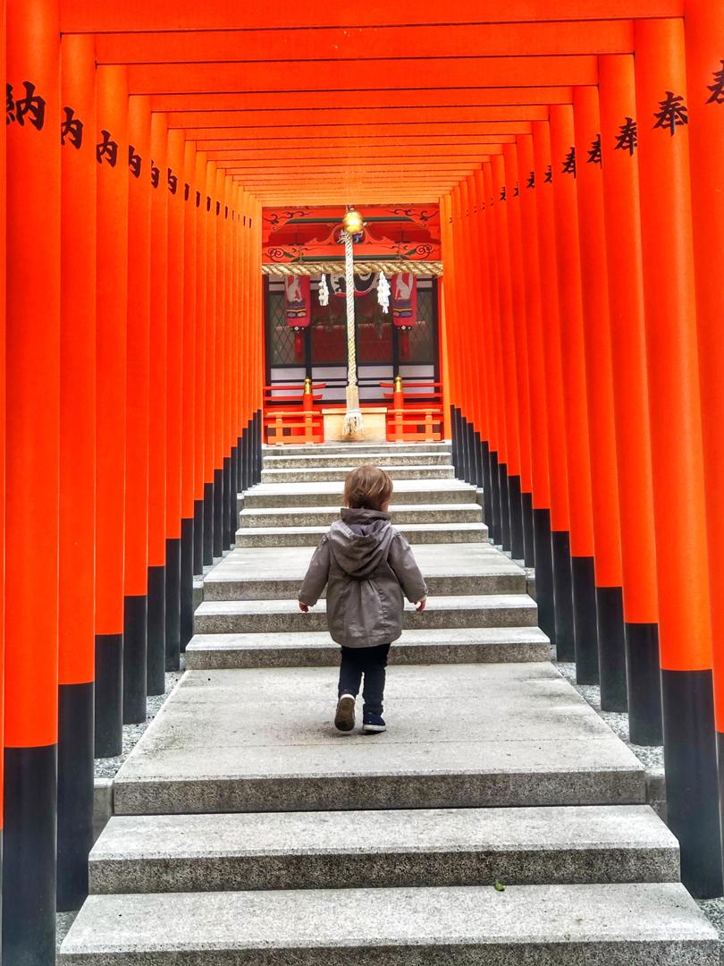 Baby walking through shrines in Japan